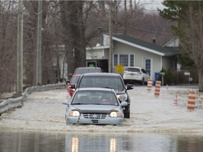 Quebec's environment minister will chair a conference of experts   on the flooding that affected more than 280 municipalities across the province, including the town of Rigaud, pictured here on April 20.