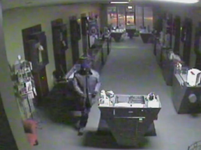 An image from Skinner & Nadeau's video surveillance shows a robbery in progress at the jewelry store in April 2017.