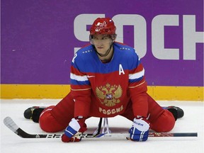 Russia forward Alexander Ovechkin stretches before playing against Slovenia in a men's ice hockey game at the 2014 Winter Olympics, Thursday, Feb. 13, 2014, in Sochi, Russia. Russian superstar Alex Ovechkin still plans to play in the 2018 Winter Olympics, even if it means leaving his Washington Capitals in the middle of the NHL season.