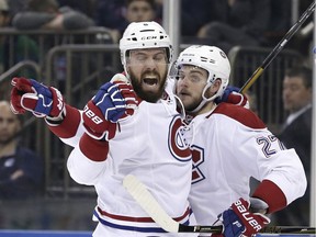 Montreal Canadiens' Shea Weber (left) celebrates his goal with Alex Galchenyuk during the third period against the New York Rangers, Sunday, April 16, 2017, in New York. The Canadiens defeated the Rangers 3-1.