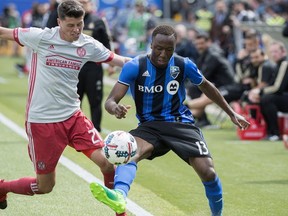 Impact's Ballou Jean-Yves Tabla, right, challenges Atlanta United's Mark Bloom during second half MLS soccer action in Montreal on Saturday, April 15, 2017.