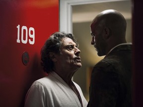 This image released by Starz shows Ian McShane, left, and Ricky Whittle in a scene from, "American Gods." premiering April 30 at 9 p.m. (Jan Thijs/Starz via AP) ORG XMIT: NYET261