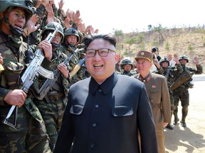 This undated picture released from North Korea's official Korean Central News Agency (KCNA) shows North Korean leader Kim Jong-Un inspecting the "Dropping and Target-striking Contest of KPA Special Operation Forces - 2017" at an undisclosed location in North Korea.