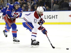 New York Rangers' Brady Skjei chases Montreal Canadiens' Torrey Mitchell during the first period of an NHL hockey game in Game 4 of an NHL hockey first-round playoff series Tuesday, April 18, 2017, in New York.