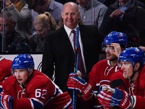 Head coach of the Montreal Canadiens Claude Julien smiles behind the bench during the NHL game against the Winnipeg Jets at the Bell Centre on Feb. 18, 2017, in Montreal.