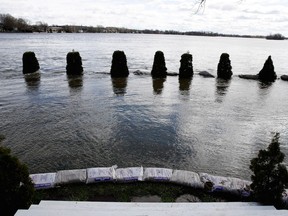 Sandbags protect the entrance to home as the Rivière des Prairies rises, flooding Île-Mercier in Montreal on Wednesday May 3, 2017.