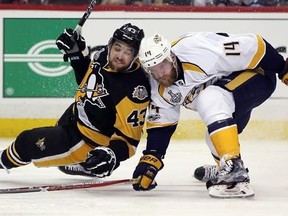 Nashville Predators&#039; Mattias Ekholm (14) checks Pittsburgh Penguins&#039; Conor Sheary (43) to the ice during the second period in Game 1 of the NHL hockey Stanley Cup Finals in Pittsburgh on Monday, May 29, 2017. Make no mistake, P.K. Subban is the engine that makes the Preds top pair go, but Mattias Ekholm, the 37th defenceman picked in the 2009 draft, has quietly emerged as his rather effective sidekick and a secret weapon for countering Sidney Crosby and Evgeni Malkin in the Stanley Cup final. TH