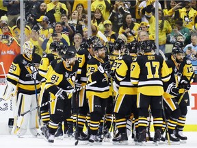 Pittsburgh Penguins celebrate after defeating the Nashville Predators 5-3 in Game One of the 2017 NHL Stanley Cup Final at PPG Paints Arena on May 29, 2017 in Pittsburgh, Pennsylvania.