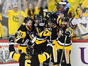 Evgeni Malkin (#71) of the Pittsburgh Penguins celebrates with teammated after scoring a goal during the third period in Game Two of the 2017 NHL Stanley Cup Final against the Nashville Predators at PPG Paints Arena on May 31, 2017 in Pittsburgh, Pennsylvania.