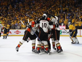 Corey Perry #10 of the Anaheim Ducks celebrates with teammates after scoring a goal during the overtime period to defeat the Nashville Predators 3-2 in Game Four of the Western Conference Final during the 2017 Stanley Cup Playoffs at Bridgestone Arena on May 18, 2017 in Nashville, Tennessee.