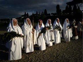 Actors dressed as Ancient Romans perform the "Pelilia" to celebrate the anniversary of the legendary foundation of the eternal city in 753 B.C., in Rome's Circo Massimo, on April 21, 2012.