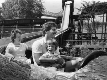 September 1983 — Alan and Celine Horic of Gatineau take Alan Jr., 2, for a ride on the La Pitoune flume ride at La Ronde.