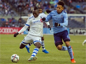 Montreal Impact's Dominic Oduro, left, vies for the ball with New York City FC's Alexander Callens, right, during an MLS Eastern Conference soccer match at Yankee Stadium in New York, Saturday, March 18, 2017. Impact veteran Oduro and homegrown prospect Anthony Jackson-Hamel could be getting more work with starting striker Matteo Mancosu out six to eight weeks with a thigh injury. Both say they are up to the task.