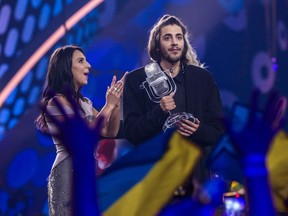 Salvador Sobral (R), the contestant from Portugal, receives the trophy after being announced as the winner from last year's winner Jamala at the Eurovision Grand Final on May 14, 2017 in Kyiv, Ukraine. Ukraine is the 62nd host of the annual iteration of the international song contest. It is the longest running international TV song competition, held primarily among countries from Europe. Each participating country will perform an original song, votes cast by the other countries determine the winner. This year's winner Salvador Sobral from Portugal won with his love ballad 'Amar Pelos Dois'.