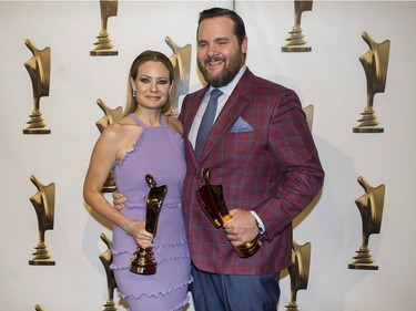 Antoine Bertrand and Catherine-Anne Toupin hold up their awards for their roles in Boomerang at the Gala Artis awards ceremony in Montreal, Sunday, May 14, 2017.