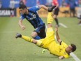 Impact's Blerim Dzemaili, left, challenges Columbus Crew's Hector Jimenez during first half MLS soccer action in Montreal on Saturday, May 13, 2017.