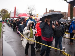 French citizens wait in line to vote, at Collège Stanislas in Montreal, Saturday, May 6. In France, Emmanuel Macron and Marine Le Pen will face each other in a runoff on May 7 for the second round of the 2017 French presidential election.