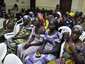 Chibok school girls recently freed from Boko Haram captivity are seen in Abuja, Nigeria, Sunday, May 7, 2017. The 82 freed Chibok schoolgirls arrived in Nigeria's capital on Sunday to meet President Muhammadu Buhari as anxious families awaited an official list of names and looked forward to reuniting three years after the mass abduction.