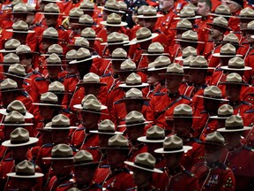 RCMP officers attend the funeral procession for slain RCMP Constable David Wynn, in St. Albert, Alta., on Monday, January 26, 2015. Wynn died four days after he and Auxiliary Constable Derek Bond were shot by Shawn Rehn in St. Albert, Alta, on Saturday January 17, 2015.