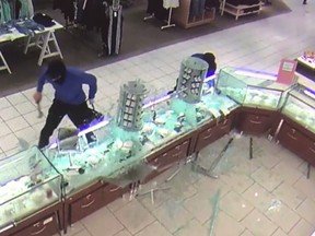 Surveillance video shows a suspect at the jewelry counter at The Bay at Fairview Pointe-Claire during what police describe as a robbery attempt.