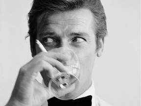 Roger Moore, downs a martini in 1968. The famed James Bond actor died in May 2017.