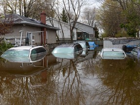 Flood waters breach the Gatineau River and flood a neighbourhood in Gatineau, on Wednesday, May 10, 2017.