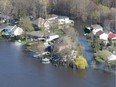 Flooded homes are seen from the air along the banks of the Ottawa river Thursday May 11, 2017 in Gatineau, Que.