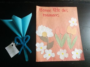 A carefully folded blue paper flower with a Popsicle stick stem and handmade cards are among the treasured Mother's Day gifts I've received from my now-teenage son over the years, Julie Anne Pattee writes, expressing dismay that some schools are now phasing out Mother's Day crafts.