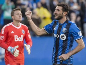 Impact midfielder Ignacio Piatti celebrates a goal on a penalty kick past Whitecaps goalkeeper Spencer Richey Tuesday night at Saputo Stadium.