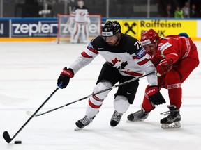Canada's Alex Killorn battles Belarus' Pavel Vorobei during the IIHF World Championship match between Belarus and Canada in Paris on May 8, 2017.