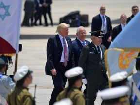 US President Donald Trump (C-L) is welcomed by Israeli President Reuven Rivlin upon Trump's arrival at Ben Gurion International Airport in Tel Aviv on May 22, 2017, as part of his first trip overseas.