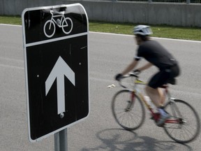 A cyclist rides on the course at Circuit Gilles-Villeneuve in Montreal June 26, 2013.