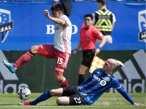 Montreal Impact's Laurent Ciman, right, challenges Atlanta United's Hector Villalba during first-half MLS soccer game action in Montreal, Saturday, April 15, 2017.