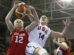 Canada's Lizanne Murphy, left, and United States' Sophie Brunner, compete for a rebound during the women's basketball gold medal game at the Pan Am Games, Monday, July 20, 2015, in Toronto.