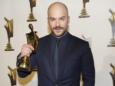 Marc-Andre Grondin holds up his award for his role in The Imposter at the Gala Artis awards ceremony in Montreal, Sunday, May 14, 2017.