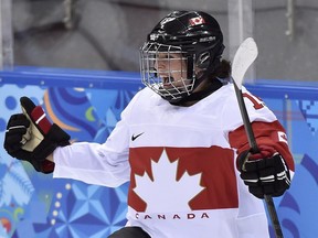 Canada forward Mélodie Daoust reacts after scoring against Switzerland during first period semi-final women's Olympic hockey action at the 2014 Sochi Winter Olympics in Sochi, Russia on Monday, February 17, 2014.