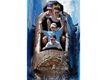 Aug. 15, 2003 — Front to back:  Julien, Antoine, Martine and Yves Brisebois-Benard ride La Pitoune at La Ronde.