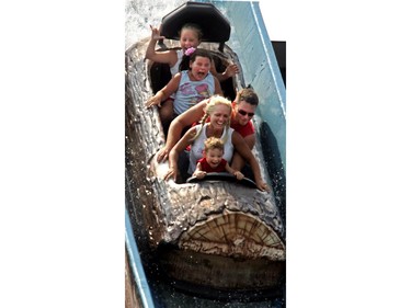 July 18, 2005 — Danick Lavoie, 2, Chantale Couture, Dany Lavoie, Jade Veilleux, 10 and Samantha Couture, 10 enjoy the almost 40-year-old La Pitoune at La Ronde.