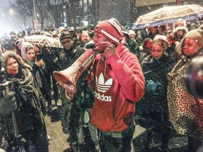 JJ, a friend of Bony Jean-Pierre, addresses demonstrators who marched through the streets of Montreal North Wednesday April 6, 2016 to protest the shooting of Bony.