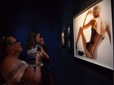 Severe corsets? Of course. Guests at Jean Paul Gaultier's exhibition: The Fashion World of Jean Paul Gaultier at the Montreal Museum of Fine Arts in 2011.  (Michelle Berg / THE GAZETTE)