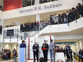 Nashville Predators' P.K. Subban waits onstage (right) as Emmanuelle Sajous, deputy secretary and deputy herald chancellor for Office of the Secretary to the Governor General (left) speaks about Subban's fundraising pledge before he received the Meritorious Service Cross from Governor General David Johnston at the Montreal Children's Hospital on March 1.