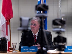 Pointe-Claire Mayor Morris Trudeau, framed by web cameras, listens to questions during the first council meeting to be webcast, March 4, 2014.