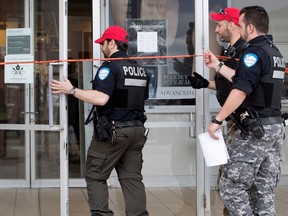 Montreal police enter The Bay at Fairview Pointe-Claire after a robbery in the jewelry section of the store in Montreal on Sunday May 14, 2017. Social media posts created a high alert and rumours of a shooting, which proved to be false.