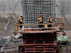 Work crews install rebar as they build a new pillar for the Upper Lachine Road overpass at the Décarie Expressway as part of the Turcot Interchange project in Montreal on Monday, May 15, 2017.