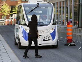 A proposed electric shuttle will come to a stop when it detects a pedestrian or another vehicle in its path.