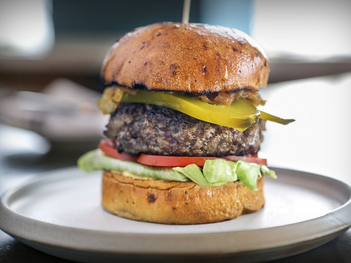  The Monkland Tavern’s 5555 hamburger is moist, meaty and stacked high.