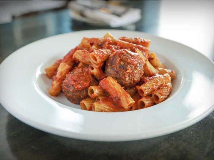  The meatballs served with the Monkland Tavern’s rigatoni offer a welcome tingle of spice.
