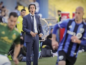 Montreal Impact head coach Mauro Biello calls out to his players during the second half of MLS game against the Portland Timbers in Montreal on Saturday, May 20, 2017.