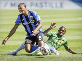 Montreal Impact's Patrice Bernier yells as he's fouled by Portland Timbers Diego Chara during first half MLS action in Montreal on Saturday May 20, 2017.