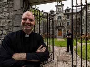 The idea behind opening the Vieux Séminaire to the public for the first time since Expo 67 "is to share this heritage with people,” says Sulpician Guy Guindon, left, with tour guide Gabriel Boucher.